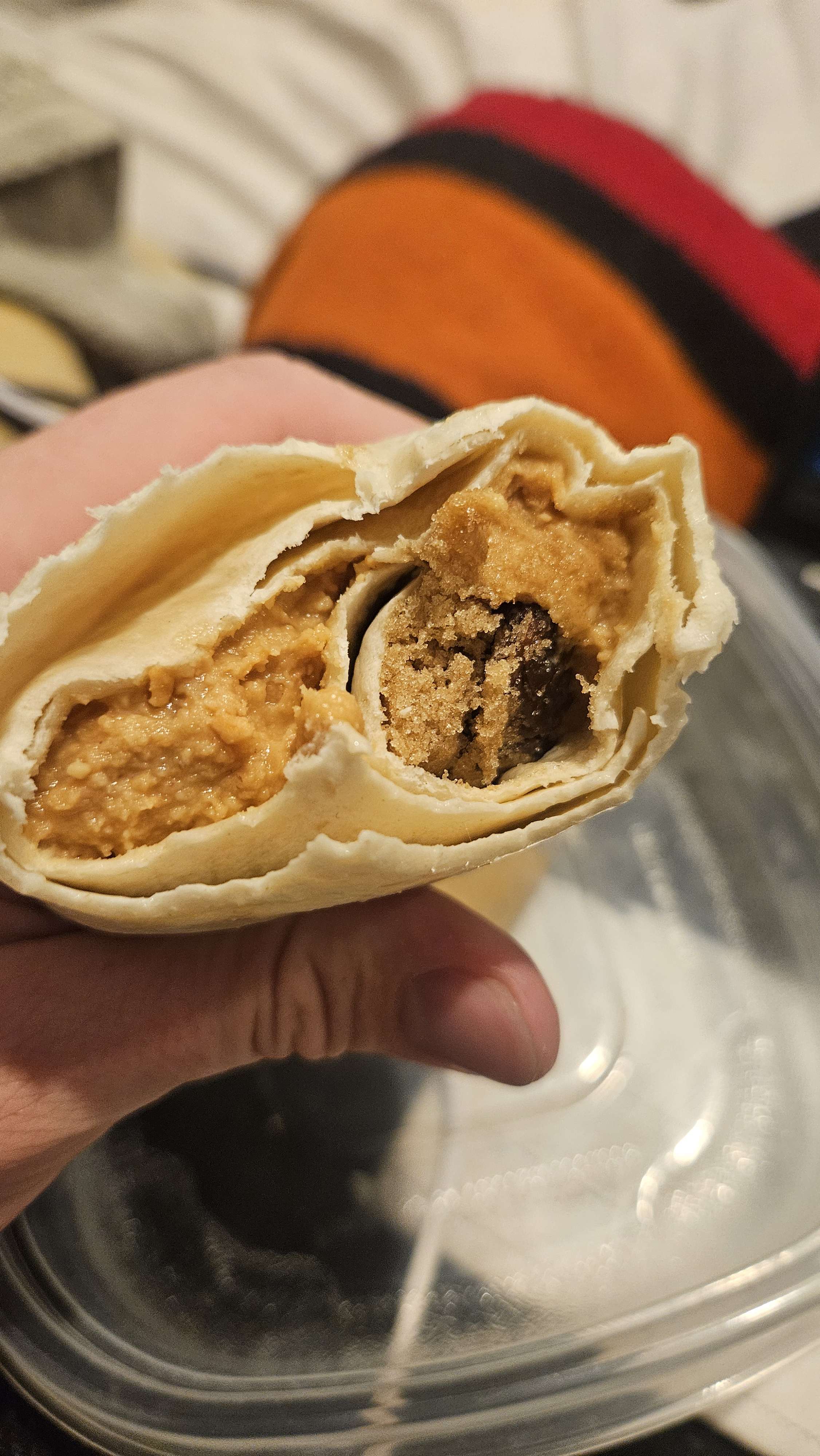 a tortilla wrapped around brown sugar, rasins, peanut butter