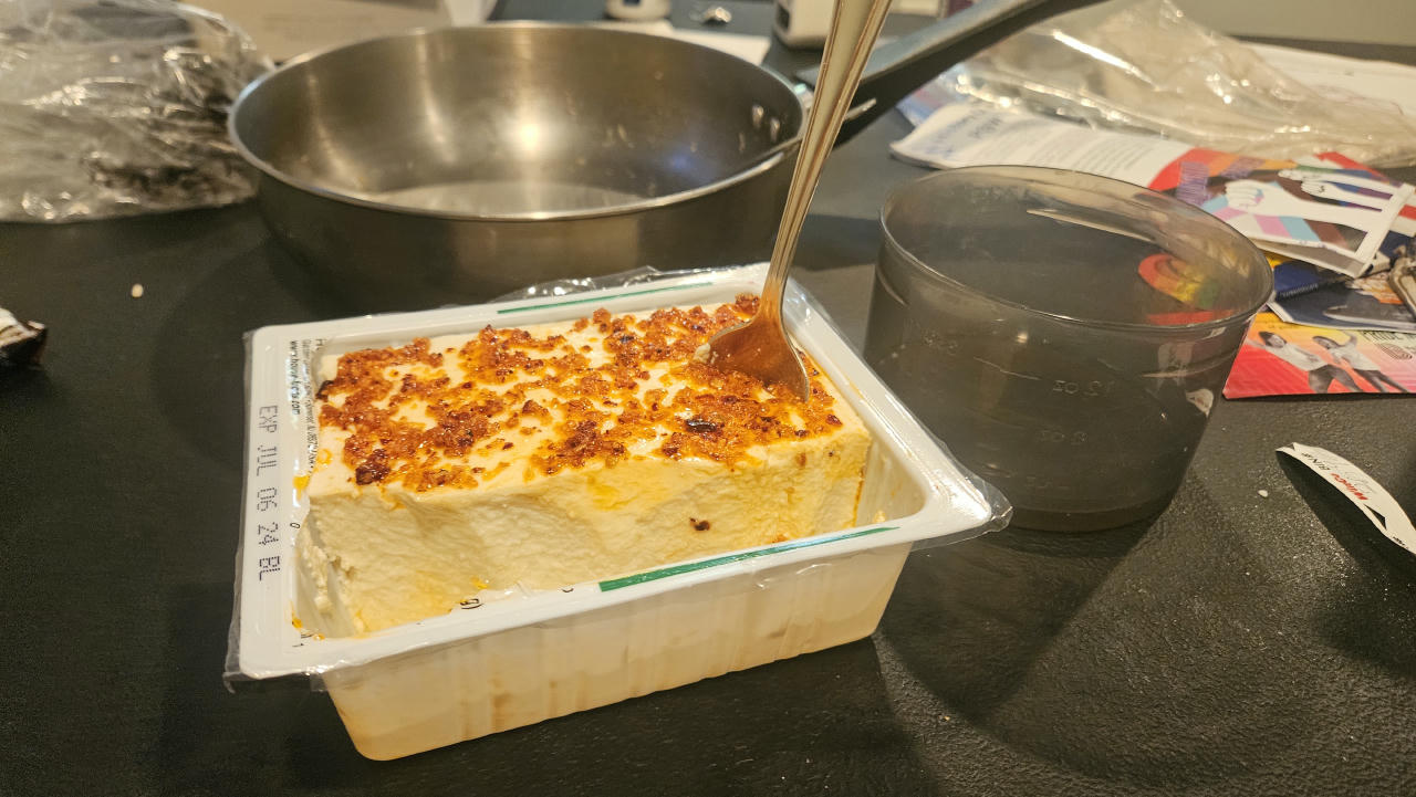 a cart of tofu covered in garlic chilli sauce